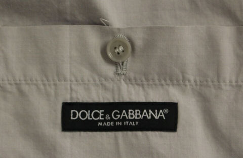 Beige silk blend dress and formal vest or gilet by Dolce & Gabbana, stylish and elegant for special occasions.