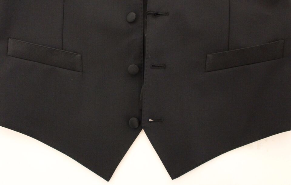 Black wool silk stretch dress vest blazer by Dolce & Gabbana, tailored fit with lapels, shown on a mannequin.