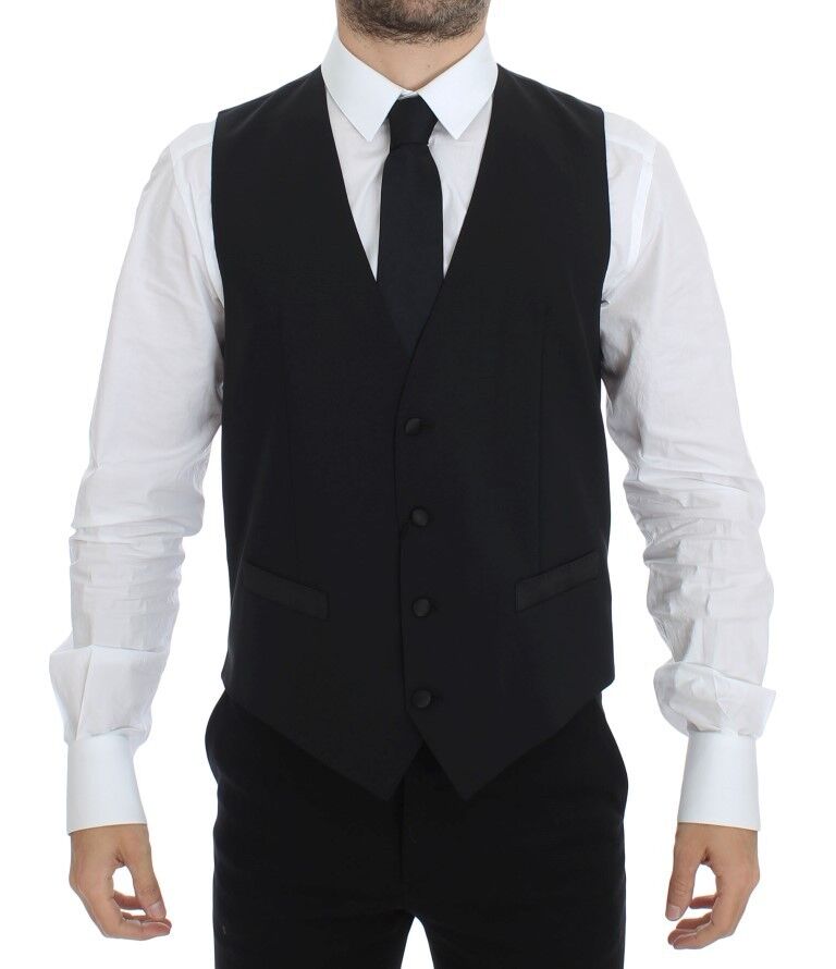 Black wool silk stretch dress vest blazer by Dolce & Gabbana displayed on a hanger with detailed fabric texture.