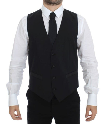Black wool silk stretch dress vest blazer by Dolce & Gabbana displayed on a hanger with detailed fabric texture.