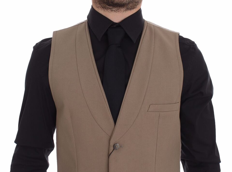 Beige cotton slim fit button-front dress vest by Dolce & Gabbana, tailored with a sleek, modern design and front button closure.