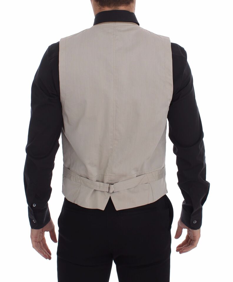 Beige cotton slim fit dress vest with button front by Dolce & Gabbana, showing tailored design and classic style.