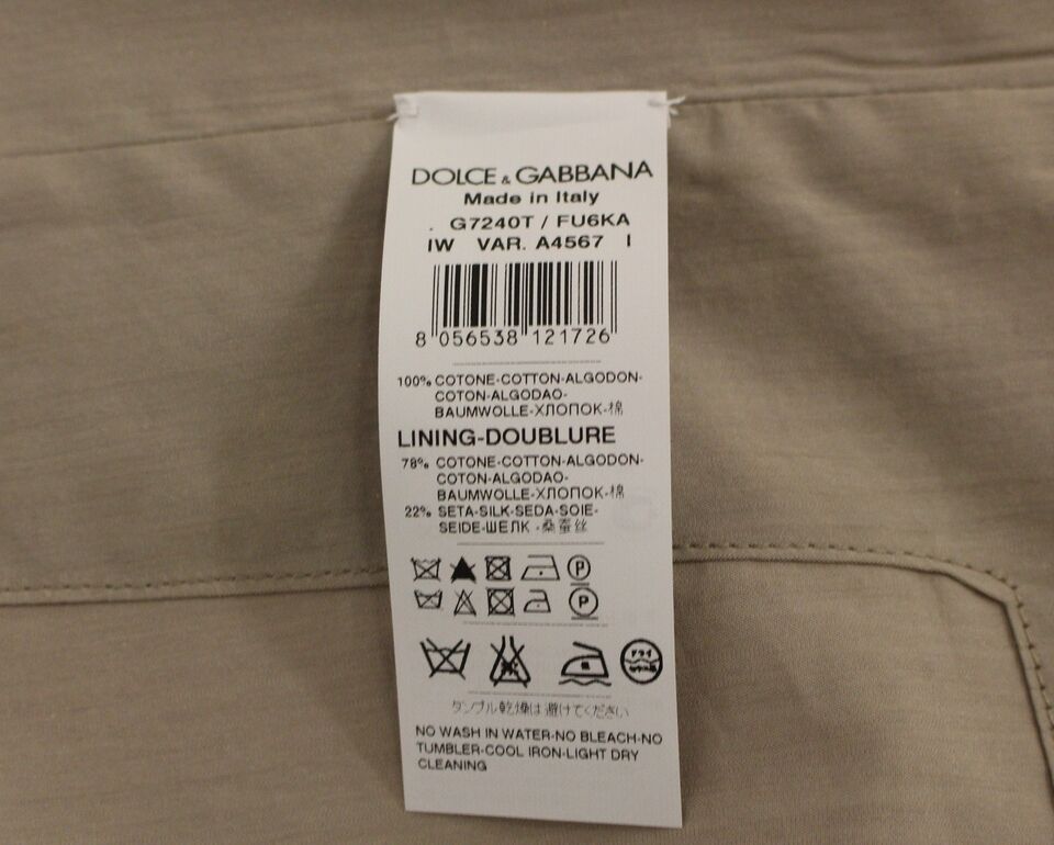Beige cotton slim fit button-front dress vest by Dolce & Gabbana, tailored with a sleek, fitted design and front buttons.