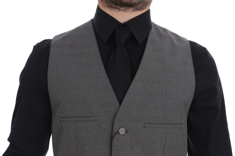 Gray cotton slim fit button-front dress vest by Dolce & Gabbana, featuring a tailored design and front button closure.