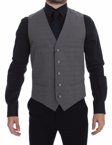 Gray cotton slim fit button-front dress vest by Dolce & Gabbana, shown on a hanger with detailed stitching and tailored fit.