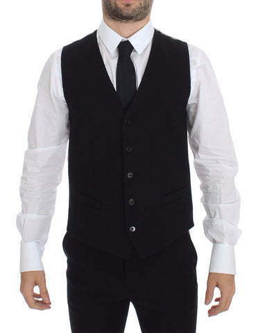Black cotton dress vest blazer jacket by Dolce & Gabbana, shown on a hanger with details of the tailored fit and fabric texture.
