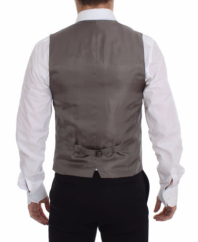 Beige cotton dress vest blazer jacket by Dolce & Gabbana, tailored fit with lapels and button closure, stylish and sophisticated.