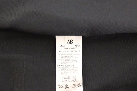 Blue cotton stretch dress vest blazer by Dolce & Gabbana, tailored fit with lapels, displayed on a hanger.