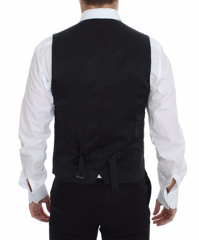 Gray wool stretch dress vest blazer by Dolce & Gabbana, tailored fit with lapels, worn over a shirt.