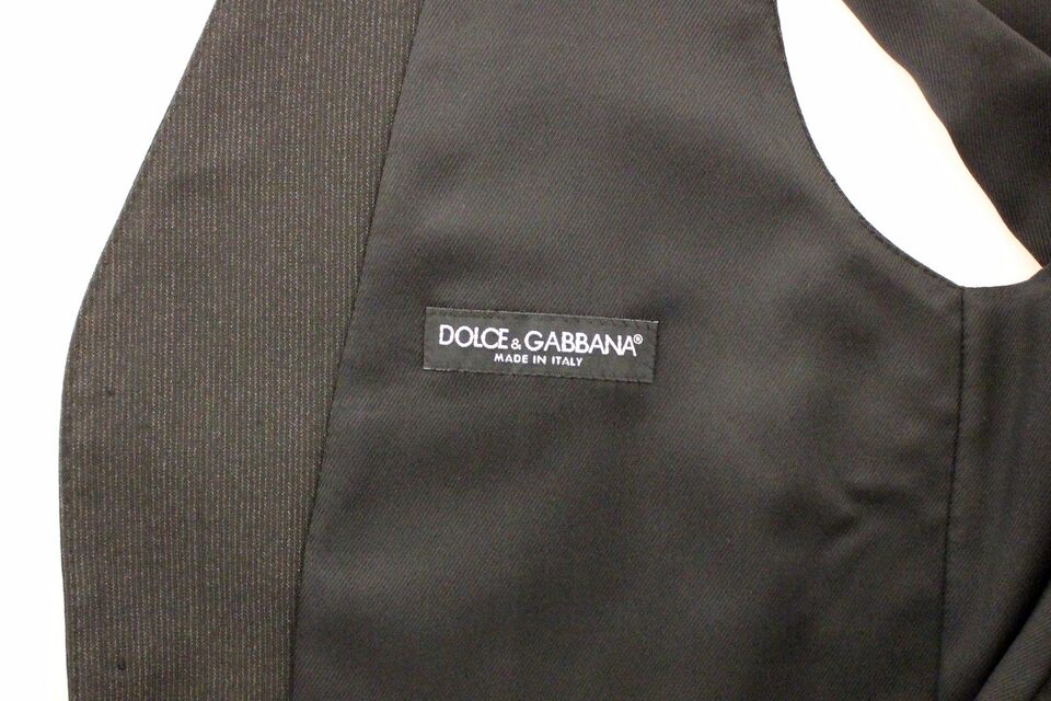 Gray wool stretch dress vest blazer by Dolce & Gabbana, tailored fit with sleek lapels and button closure.