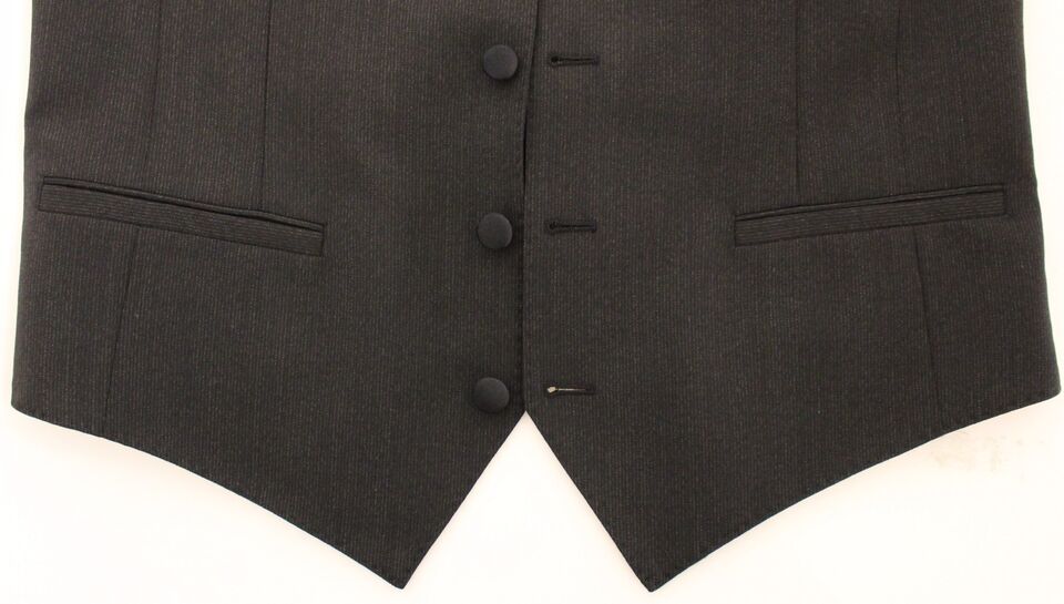 Gray wool stretch dress vest blazer by Dolce & Gabbana, tailored fit with lapel collar and button closure, worn on a model.