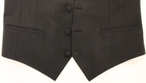 Gray wool stretch dress vest blazer by Dolce & Gabbana, tailored fit with lapel collar and button closure, worn on a model.