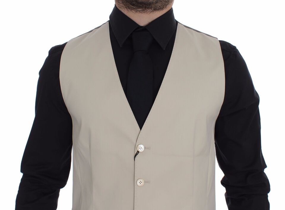 Beige cotton stretch dress vest blazer by Dolce & Gabbana, tailored fit with lapel collar and button closure.