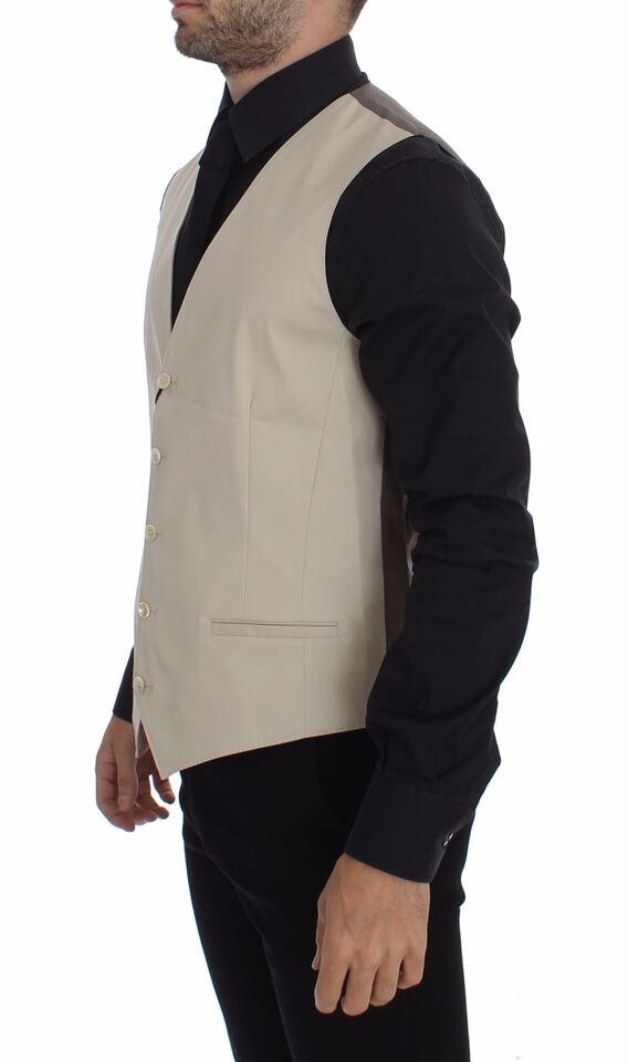 Beige cotton stretch dress vest blazer by Dolce & Gabbana, tailored fit with lapel collar and button closure, front pockets.