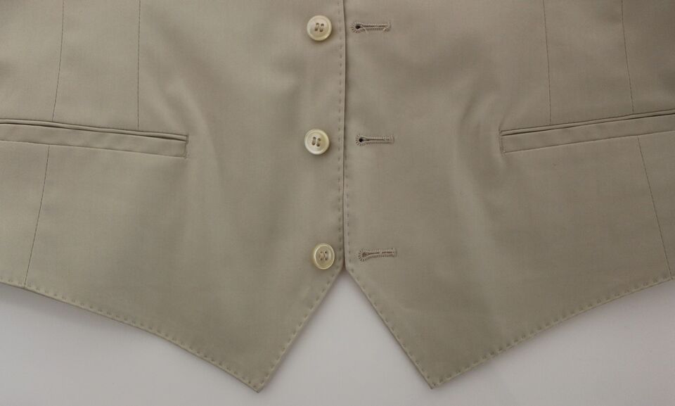 Beige cotton stretch dress vest blazer by Dolce & Gabbana, tailored fit with lapel collar and button closure.