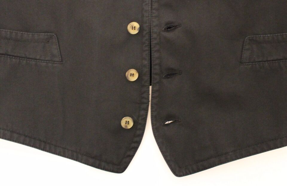 Black cotton viscose dress vest blazer by Dolce & Gabbana, tailored fit with lapels and button closure, shown on a hanger.