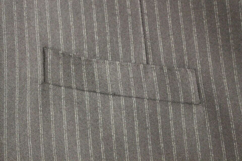 Black wool single-breasted vest with white stripe details from Dolce & Gabbana, shown on a hanger with a tailored fit.