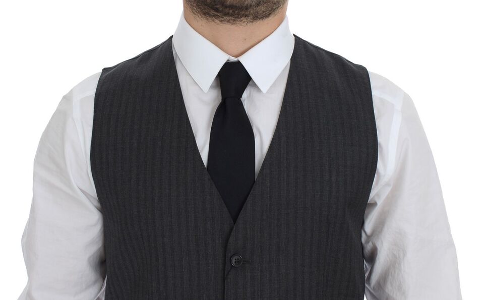 Black striped wool single-breasted vest by Dolce & Gabbana, tailored with a classic fit and button closure.