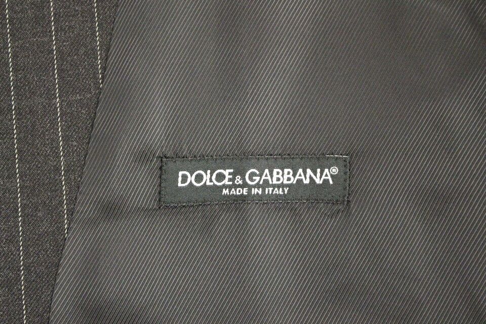 Gray striped wool Dolce & Gabbana logo vest, sleeveless gilet with front buttons and ribbed trim, casual luxury fashion piece.