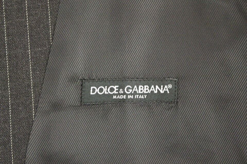 Gray striped wool Dolce & Gabbana logo vest, sleeveless gilet with front buttons and ribbed trim, casual luxury fashion piece.