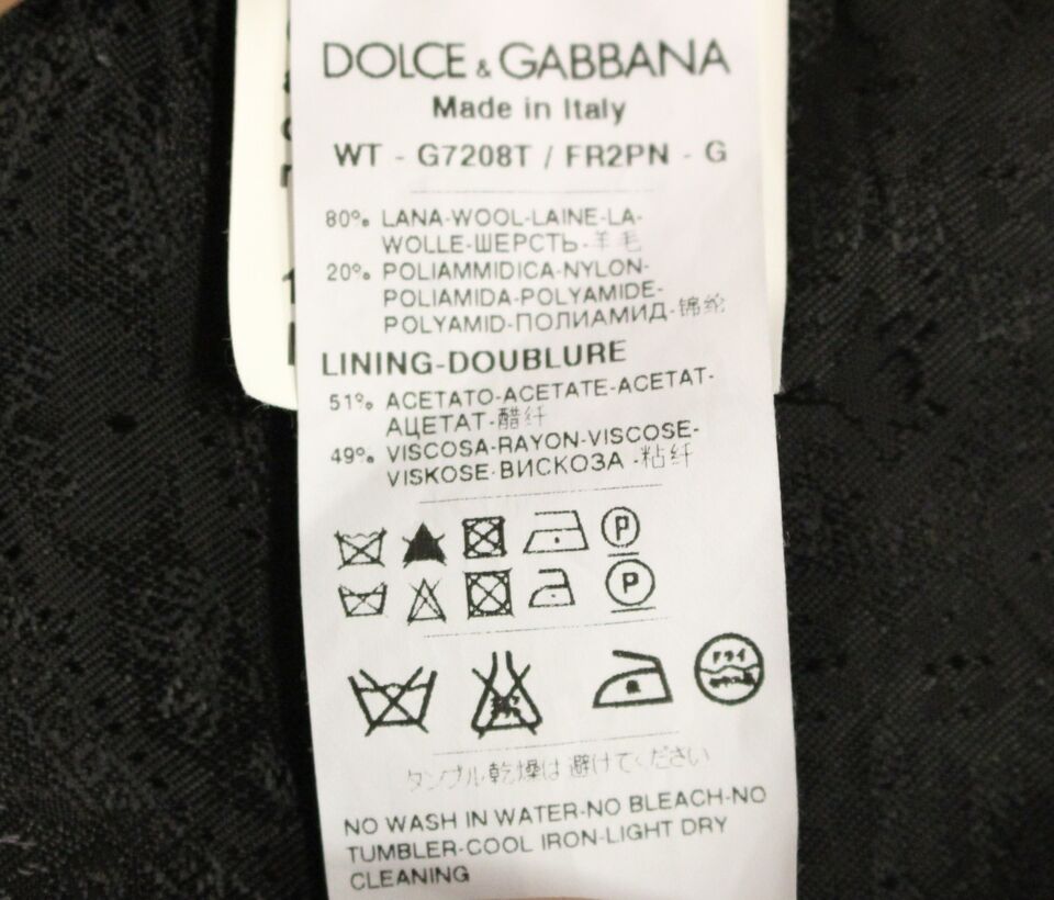 Black striped wool Dolce & Gabbana logo vest gilet with front pockets and button closure, stylish and cozy for casual wear.