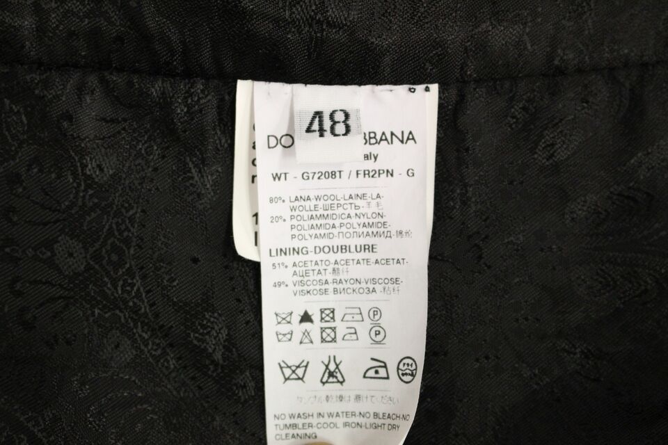 Black striped wool Dolce & Gabbana logo vest gilet with sleeveless design and front button closure.