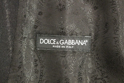 Black striped wool Dolce & Gabbana logo vest gilet, sleeveless wool waistcoat with bold stripe pattern, front logo detail.