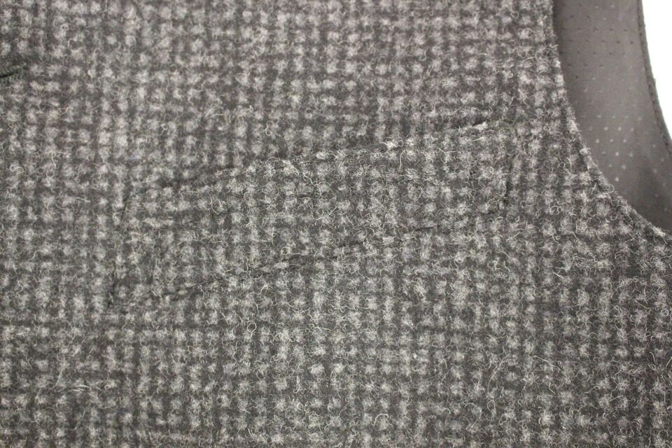Gray wool blend vest gilet by Dolce & Gabbana, featuring a tailored fit and textured fabric, displayed flat on a neutral background.