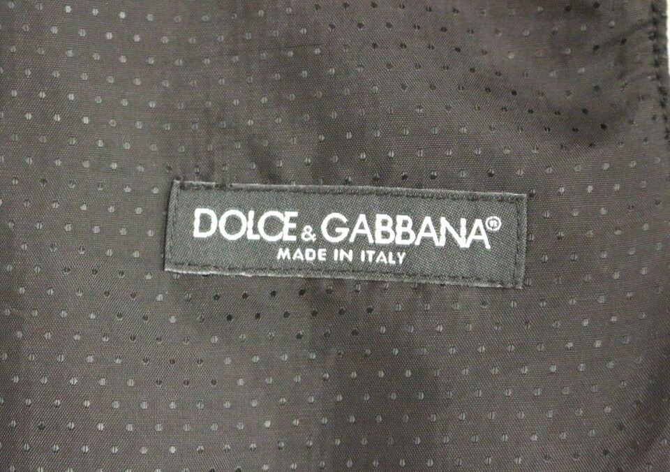 Gray wool blend Dolce & Gabbana logo vest with sleeveless design and front zipper, displayed on a neutral background.