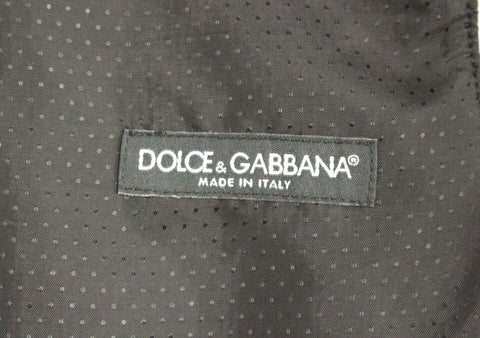 Gray wool blend Dolce & Gabbana logo vest with sleeveless design and front zipper, displayed on a neutral background.