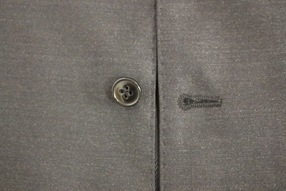 Gray wool and silk dress vest gilet by Dolce & Gabbana, featuring tailored fit and classic design, shown on a mannequin.