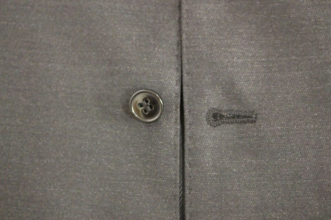Gray wool and silk dress vest gilet by Dolce & Gabbana, featuring tailored fit and classic design, shown on a mannequin.