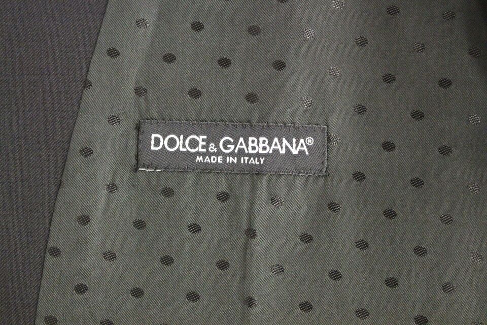 Black wool formal dress vest by Dolce & Gabbana, tailored fit with sleek design, front button closure, and classic V-neck style.