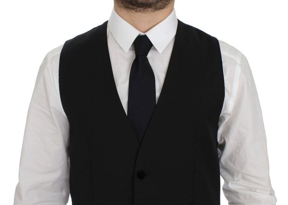 Black wool formal dress vest by Dolce & Gabbana, featuring tailored fit and classic design, suitable for elegant occasions.
