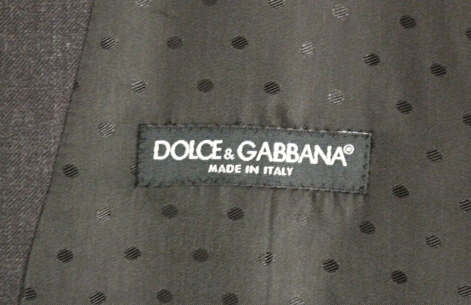 Gray wool formal dress vest by Dolce & Gabbana, tailored men's gilet with classic design and refined texture.