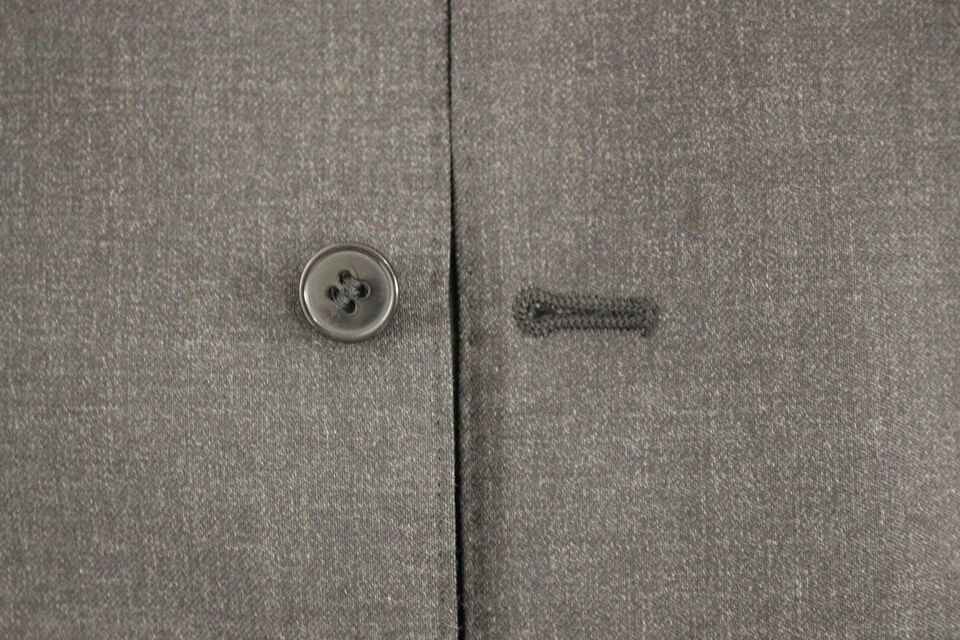 Gray wool formal dress vest by Dolce & Gabbana, stylish men's gilet with tailored fit and classic design.
