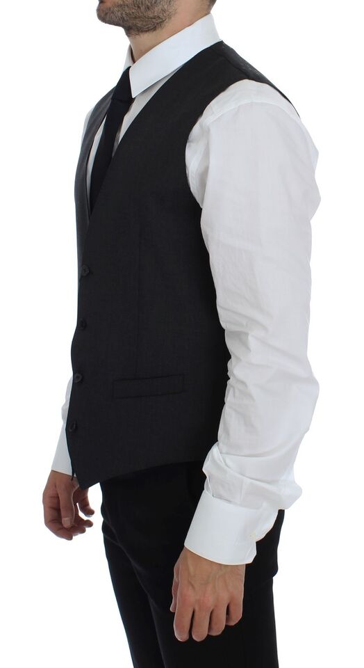 Gray wool formal dress vest by Dolce & Gabbana, tailored fit gilet with classic design and button closure, suitable for elegant occasions.