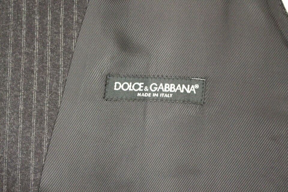 Gray striped wool single-breasted vest by Dolce & Gabbana displayed on a hanger.
