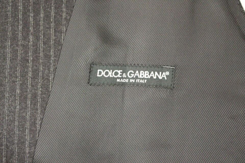 Gray striped wool single-breasted vest by Dolce & Gabbana displayed on a hanger.