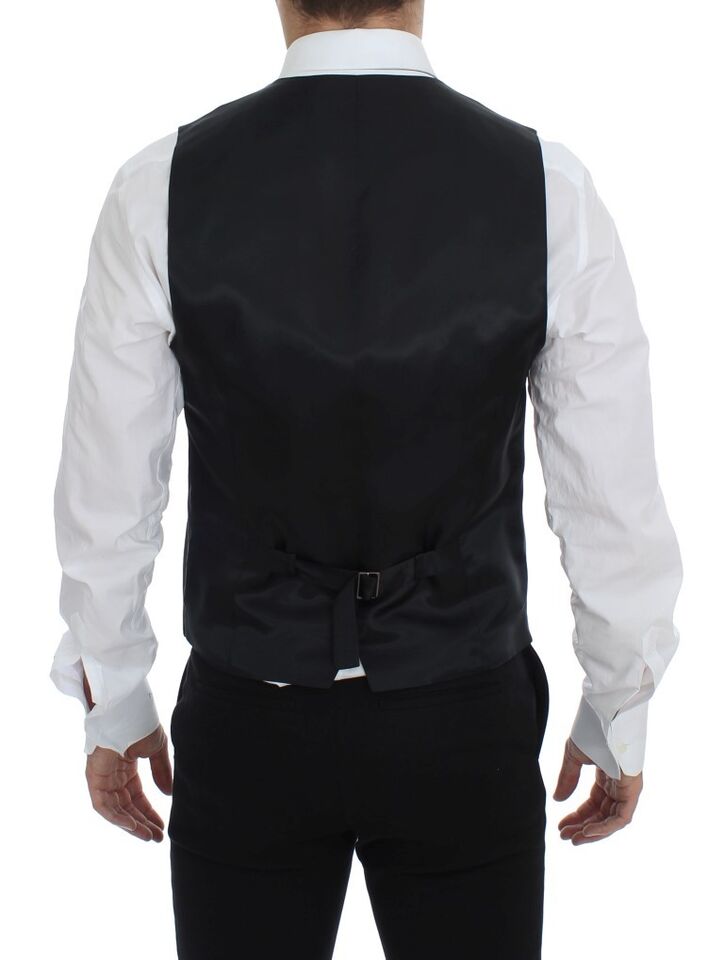 Black striped wool single-breasted vest by Dolce & Gabbana, featuring tailored fit and classic design, displayed on a neutral background.
