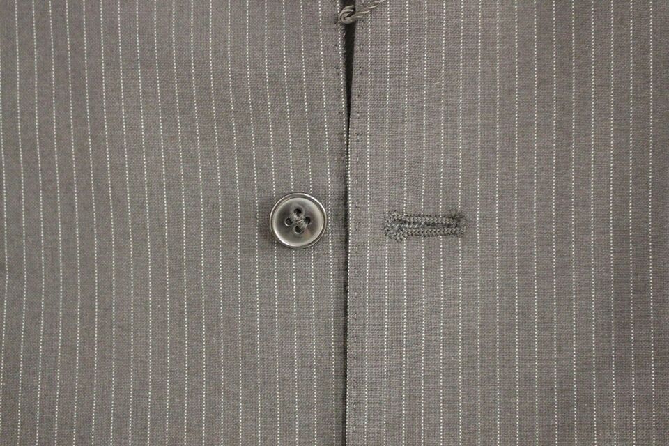 Black striped wool single-breasted vest by Dolce & Gabbana, with tailored fit and classic lapel details.