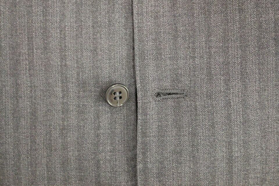 Gray striped wool single-breasted vest by Dolce & Gabbana, featuring tailored fit and classic design.