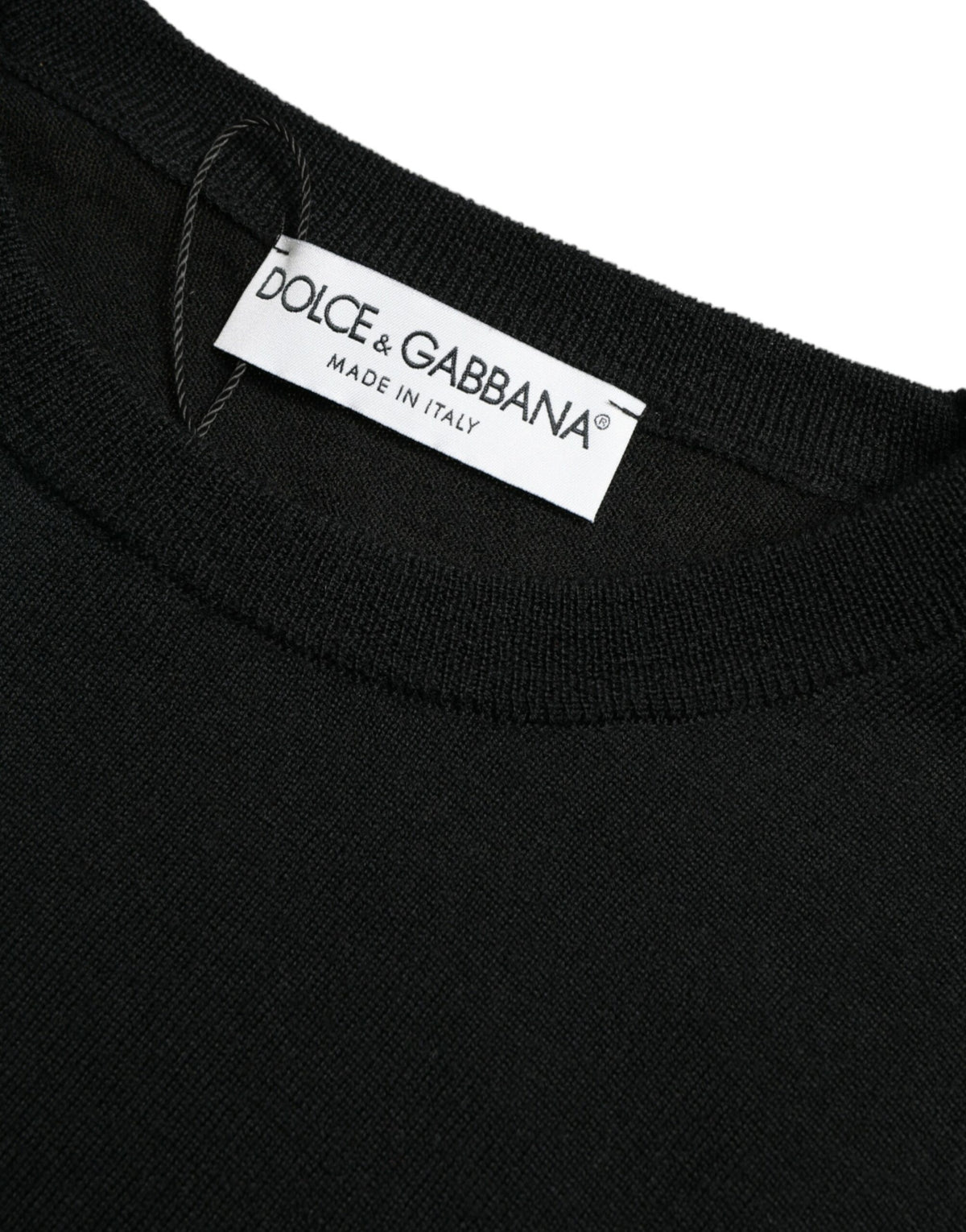 Black wool round neck pullover sweater by Dolce & Gabbana displayed on a mannequin, showcasing its classic fit and soft texture.