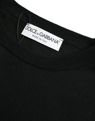 Black wool round neck pullover sweater by Dolce & Gabbana displayed on a mannequin, showcasing its classic fit and soft texture.