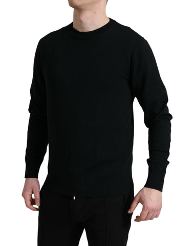 Black wool round neck pullover sweater by Dolce & Gabbana, close-up of the soft knit fabric and classic fit.