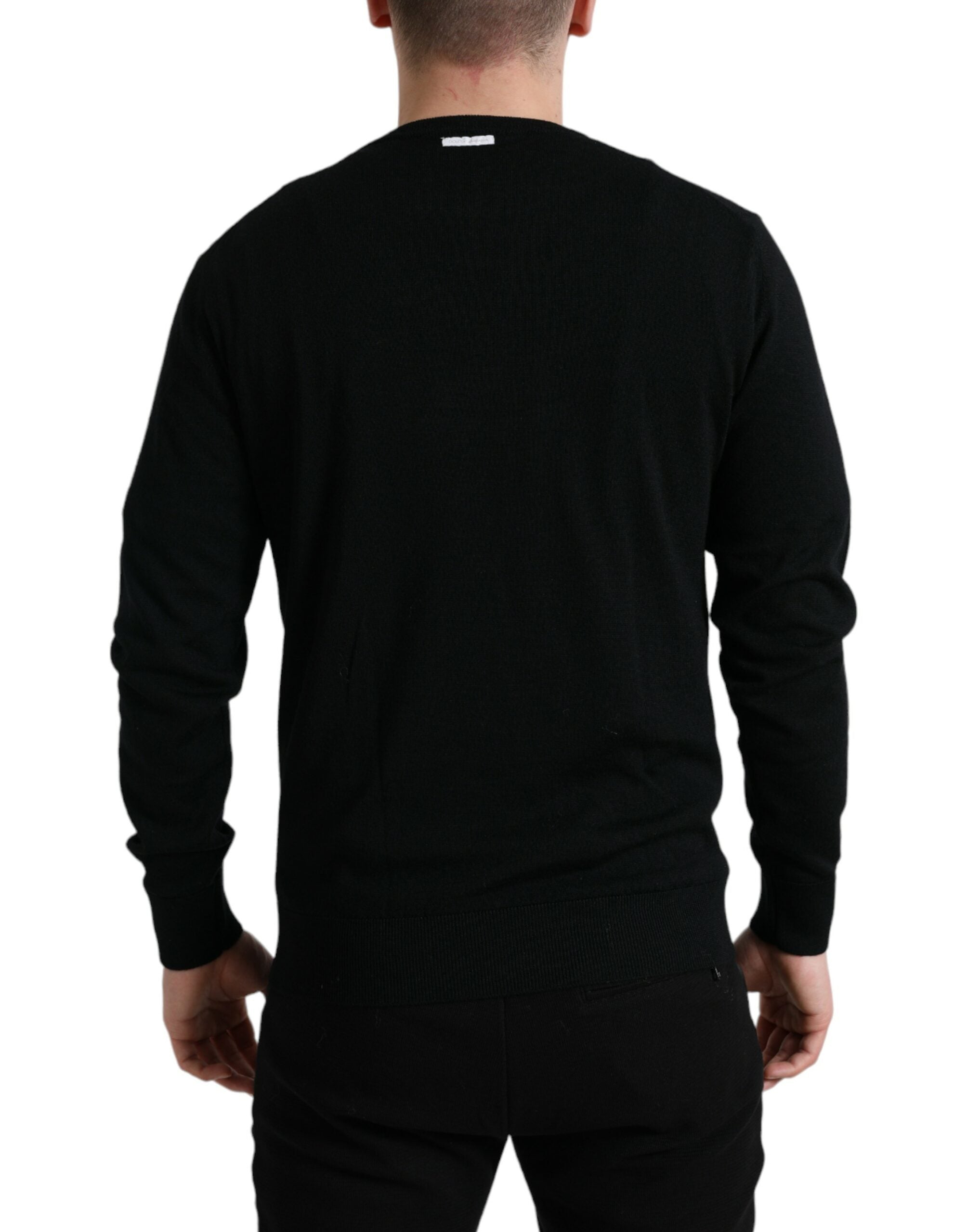 Black wool round neck pullover sweater by Dolce & Gabbana, featuring a classic fit and smooth knit fabric.