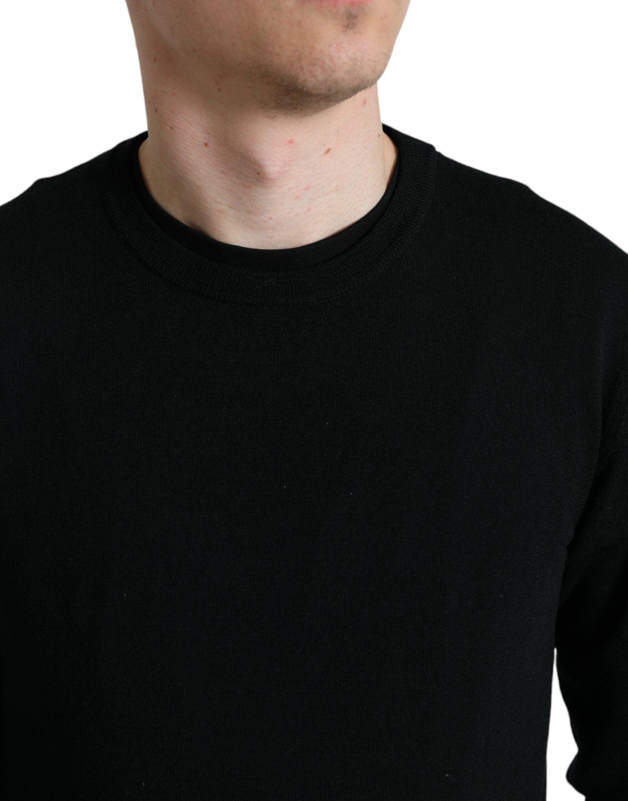 Black wool round neck pullover sweater by Dolce & Gabbana, featuring a classic fit and smooth knit fabric.