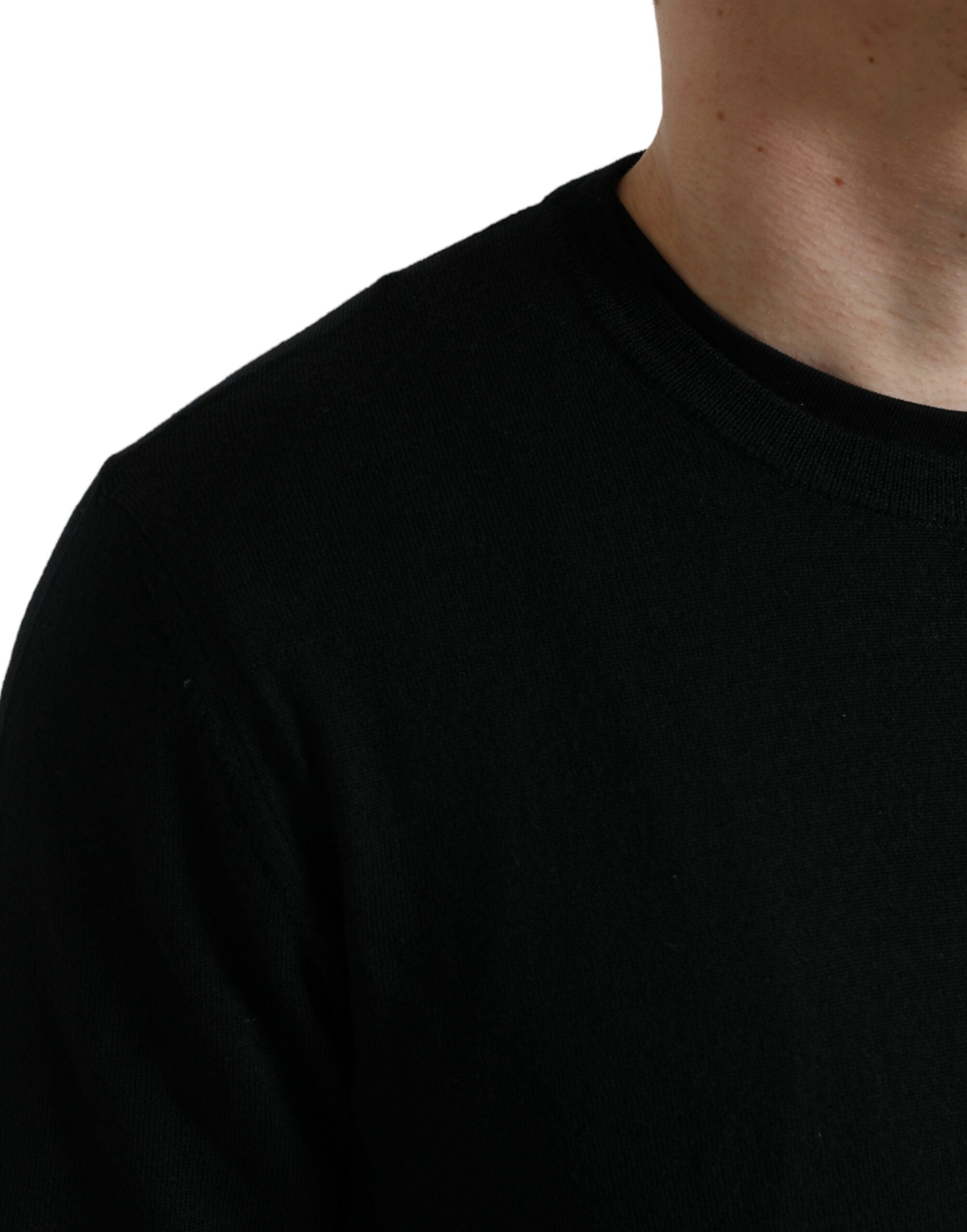 Black wool round neck pullover sweater by Dolce & Gabbana, close-up showing soft knit fabric and classic fit.