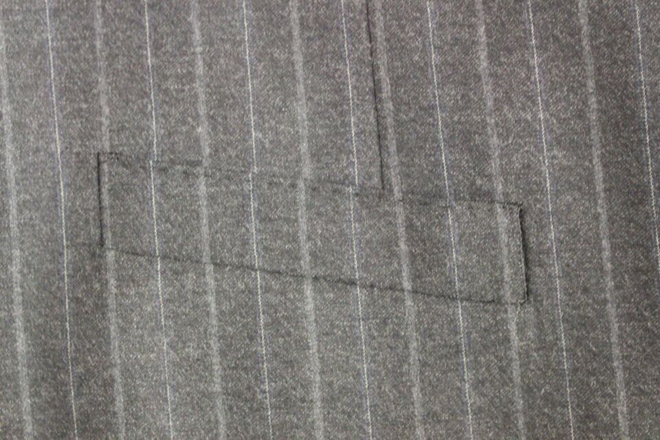 Gray striped wool vest with Dolce & Gabbana logo, sleeveless gilet featuring a stylish, textured pattern.