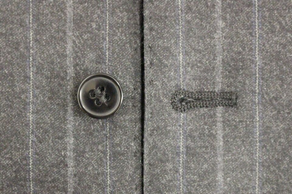 Gray striped wool logo vest by Dolce & Gabbana, featuring a sleeveless design and classic wool texture.